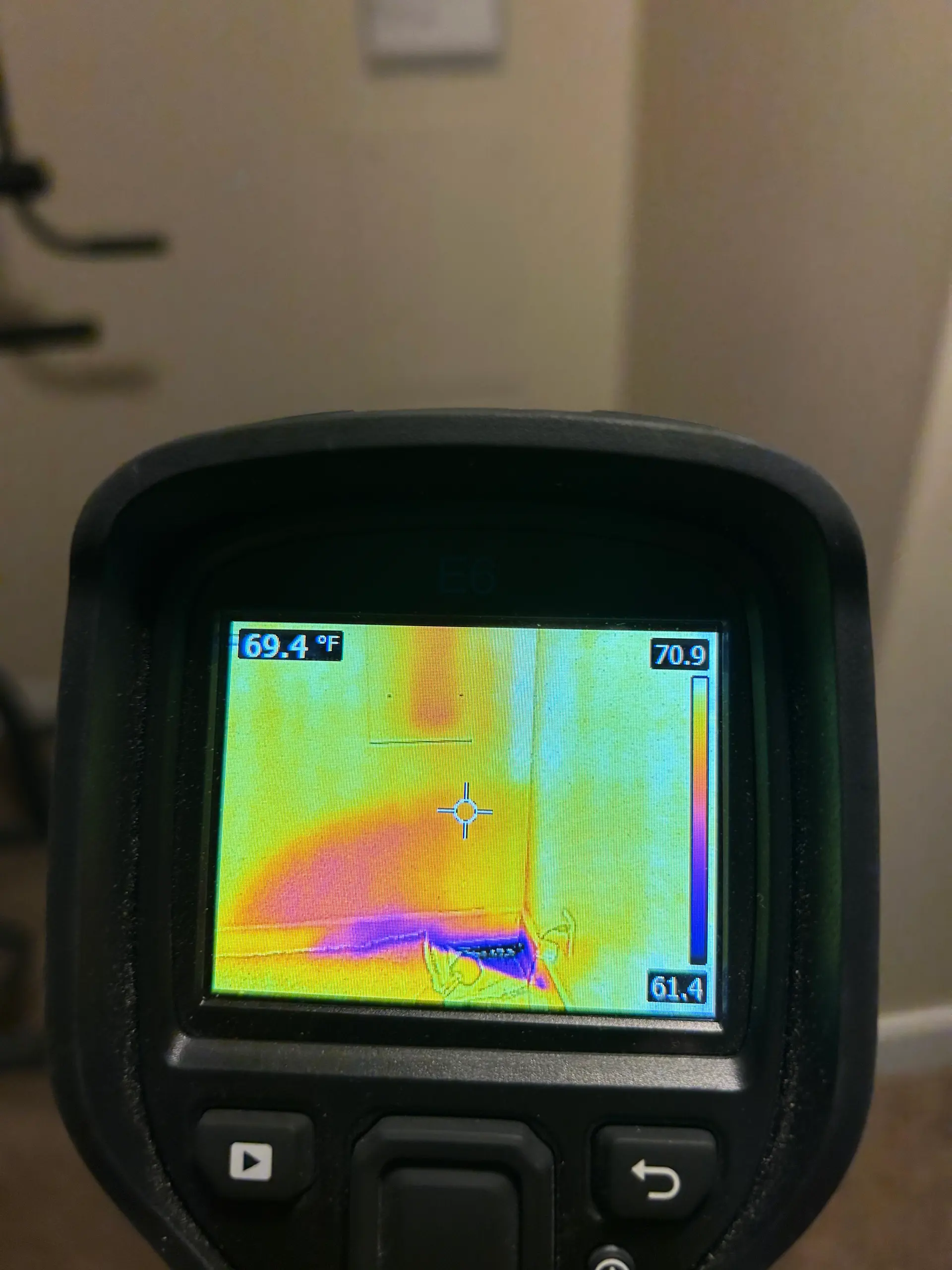 Thermal camera detecting water intrusion along a baseboard
